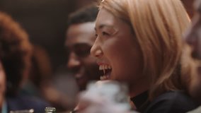 beautiful asian woman hanging out with friends in restaurant laughing enjoying conversation socializing at party gathering - Powered by Shutterstock - Get 15% off with code: PIKWIZARD15