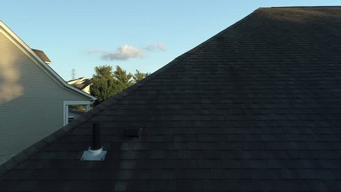 This High Definition drone aerial footage is of a suburban community in Pennsylvania revealed from a house roof top.