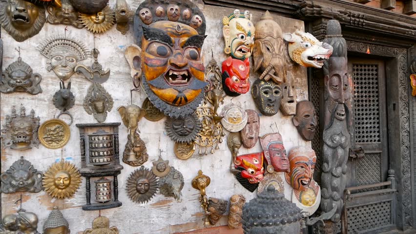 Traditional colorful Handmade wooden masks and handicrafts for sale in Kathmandu, Nepal. Souvenir Shops in Durbar of Bhaktapur and Patan. Swayambhunath decorative asian market.