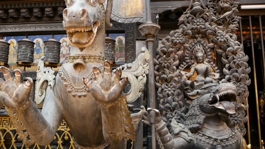 Ancient bronze and brass mythological sculptures and artifacts, Rudra Varna Mahavihar, unique golden buddhist temple in Lalitpur (Patan). World heritage site. Tibetan buddhism. Durbar Square, Nepal.
