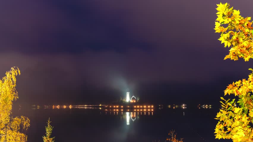 Aerial timelapse from night to morning of the famous Lake bled with the tiny island and Pilgrimage Church of the Assumption of Maria at Slovenia