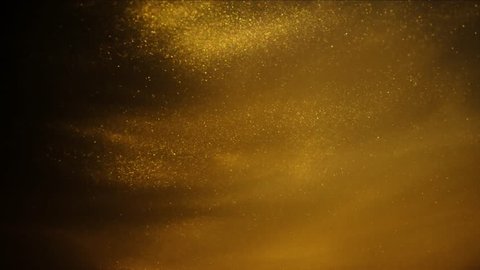 Golden sand or dust creating abstract cloud formations. Art backgrounds.