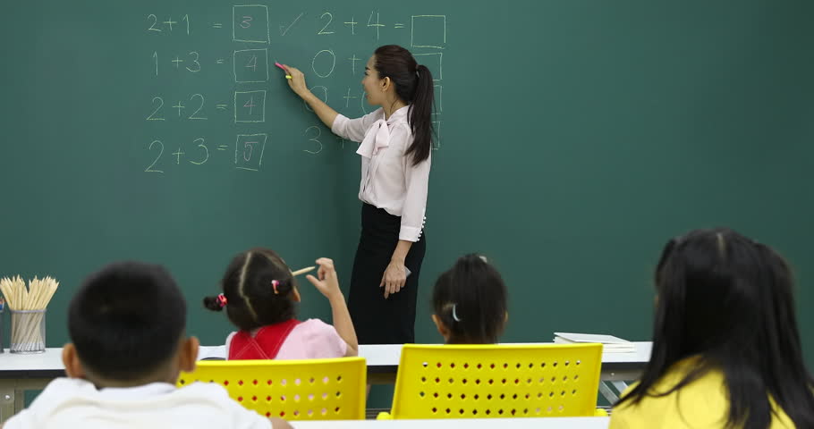 teacher writing on board