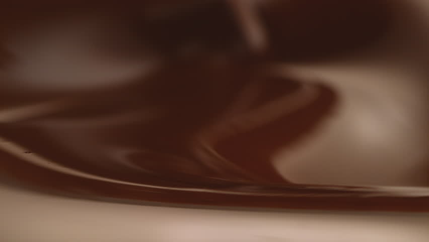 Rice Krispies hazelnut and hazelnut crack fall into chocolate bath waves in slow motion Royalty-Free Stock Footage #1024796129