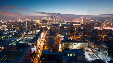 Amazing motion timelapse of Moscow city center on the night, view from above. Aerial shot of busy highways with a lot of traffic and glittering buildings lights. 8K ultra high definition footage.