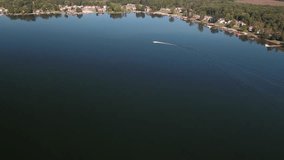 Aerial recreational boaters sailing on a fresh water sport and fishing lake