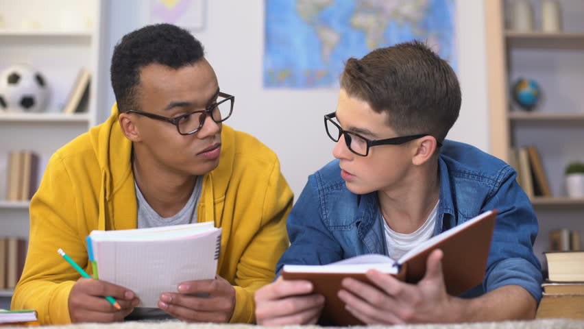 Students interests. Two teenagers studying.