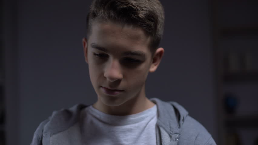 Depressed teenager unable to hear parents quarreling closing ears, troubles | Shutterstock HD Video #1024828922