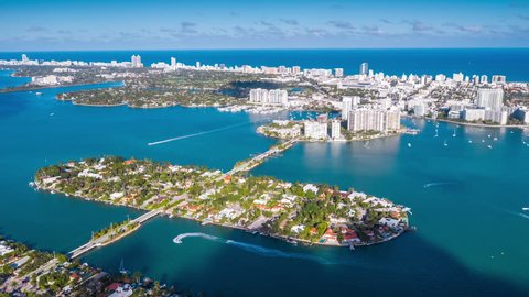 MIAMI, FLORIDA, USA - JANUARY 2019: Aerial drone panorama view flight over Miami city centre. Venetian Islands and Biscayne Bay. Streets, hotels and residential buildings from above.