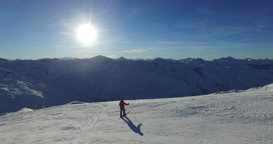 skier on the slope in the french alps: sun and snow  Royalty-Free Stock Footage #1024832459