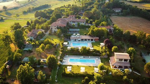 Poppi/Italy - 03.07.2015: Aerial view of traditional italian villa resort with yard and garden in sunset, Tuscany, Italy