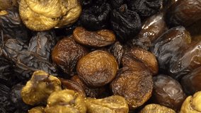 Dried fruits dried apricots, dates, figs as a background. HD video