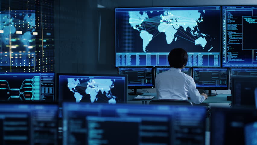 In the System Control Room Chief Operator Watches Screens With Satellite Data. Monitoring Station Has Capacity for Global Data and Monitoring, Every Interaction is Shown in Real Time on Displays Royalty-Free Stock Footage #1024872185