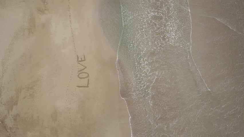 LOVE! - inscription on the sand. Feeling massage/Statement. Aerial art form. Drawing  Calligraphy on the beach. Emotion Manifesto. Devotion, affection, emotion, passion. Romantic gesture. Be yourself 