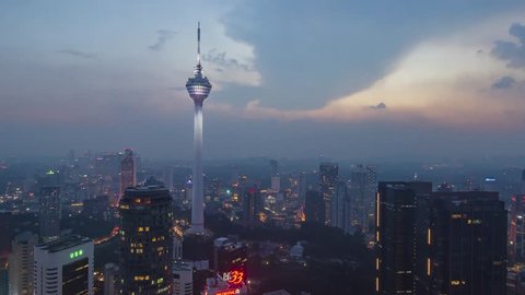 KUALA LUMPUR / MALAYSIA - FEB 22, 2019 : Kuala Lumpur city at Dusk times. Kuala Lumpur is the capital of Malaysia. Camera angle zoom out motion.