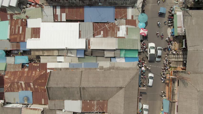 Aerial Timelapse : Maeklong Railway Market (Talad Rom Hub) This is unique market, When a train is coming vendors will close their Stall & Awnings to make space for the train passing, Thailand Asia. Royalty-Free Stock Footage #1024883261