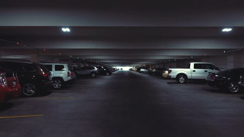 POV drive through underground parking garage in slow motion 120fps
