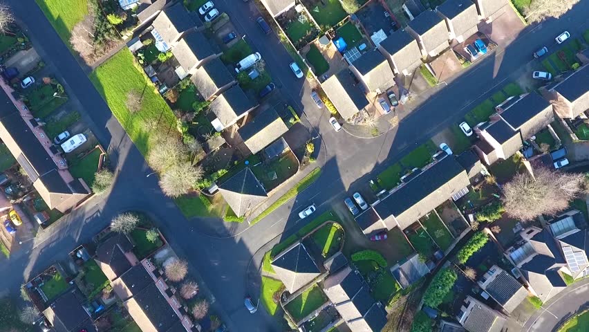 Aerial birds eye view of UK suburbs, taken on a sunny morning Royalty-Free Stock Footage #1024886876