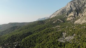 Stock video footage Aerial view of Mountains and Coast National Park in Turkey with the speedway below, Beldibi village, 4k video