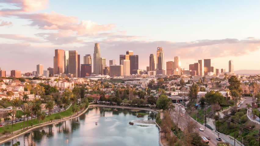 Aerial time lapse in motion or hyperlapse over Echo Park of downtown Los Angeles, California skyline and skyscrapers from above on a sunny day during golden hour before sunset. Royalty-Free Stock Footage #1024890566