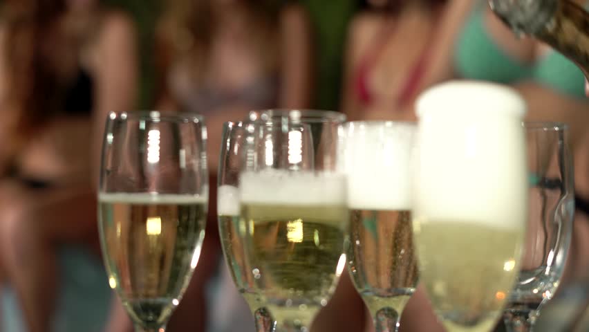 Summer party. Beautiful women in bikini at a pool party. Drinking  champagne. Summer,.Beach, night club, loft. 4K. | Shutterstock HD Video #1024894187