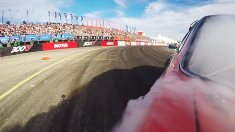 VLADIVOSTOK, RUSSIA - SEPTEMBER 16, 2018: Fantastic go pro view, red racing car drifts at track at Asia Pacific D1 Primring GP, drifting international race.