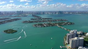MIAMI, FLORIDA, USA - JANUARY 2019: Aerial drone panorama view flight over Miami. Venetian Islands and Biscayne Bay. Streets, hotels and residential buildings from above.