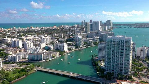MIAMI, FLORIDA, USA - JANUARY 2019: Aerial drone panorama view flight over Miami. Venetian Islands and Biscayne Bay. Hotels and residential buildings, ships and yachts from above.