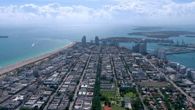 MIAMI, FLORIDA, USA - JANUARY 2019: Aerial drone high panorama view flight over Miami beach city centre. Streets, hotels and residential buildings from above.