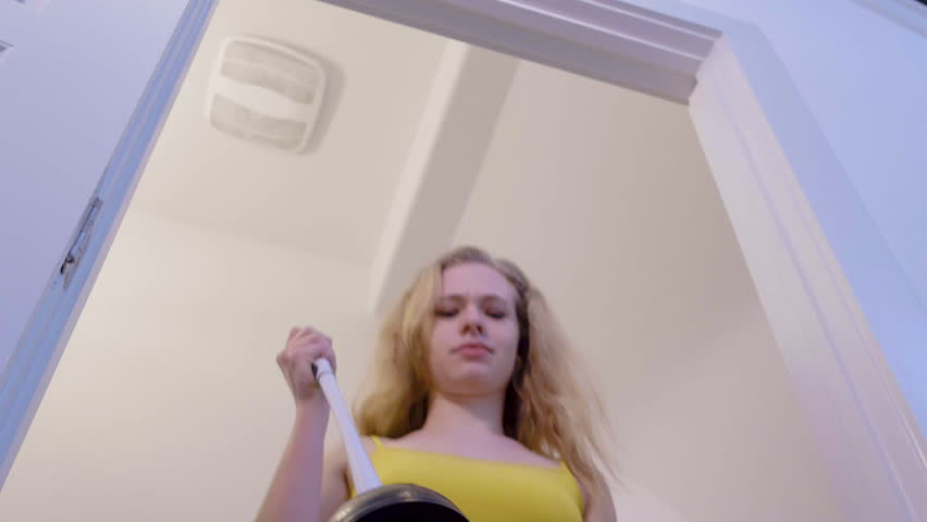 Woman approaches smelly toilet with plunger and starts to unblock, 23.98 fps Royalty-Free Stock Footage #1024915094