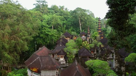 Buddhist Pura Gunung Lebah temple in Ubud tropical forest. Aerial drone 4k footage.