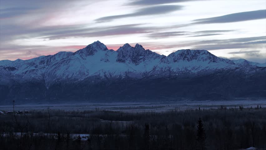 Time lapse of clouds over Anchorage peaks as the sun sets, Alaska