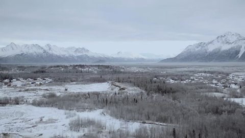 Snow covered misty scenery of Anchorage, Alaska. Wide untouched landscape