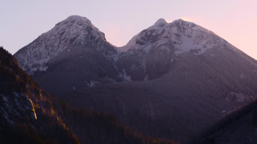 Twin peaks, Anchorage Alaska. Beautiful evening colors as sun sets over mountains 4k