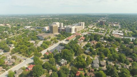 Wide panoramic aerial of the city of Tulsa, Oklahoma and surrounding residential suburbs, on a sunny day.