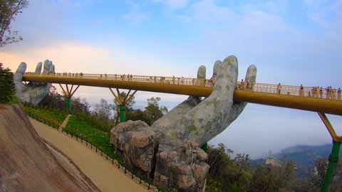 Video Time lapse at Ba Na Hills. Da Nang, Vietnam - February 26 2019:  Tourists in Golden Bridge known as “Hands of God”, a pedestrian footpath lifted by two giant hands