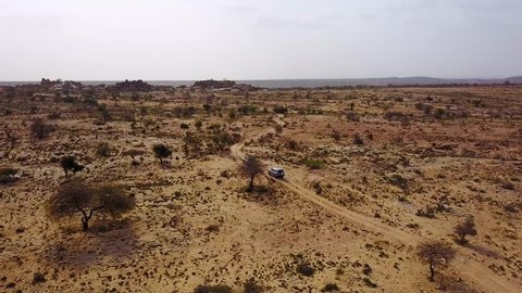 HARGEISA, SOMALIA - CIRCA 2018 - Good aerial of 4WD safari jeeps moving across Somalia near Hargeisa, Somaliland.