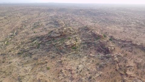 HARGEISA, SOMALIA - CIRCA 2018 - Aerial moves towards petroglyphs and cave art at Hargeisa, Somalia to reveal landscape.
