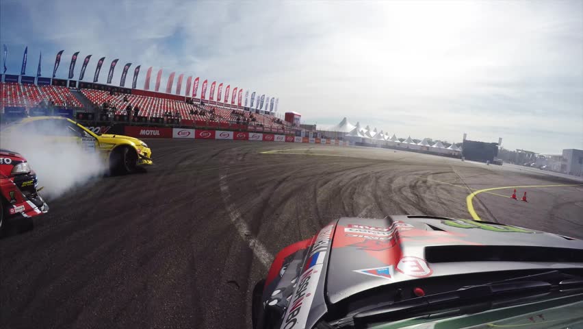 VLADIVOSTOK, RUSSIA - SEPTEMBER 16, 2018: Great go pro view from sport car drifting at Asia Pacific D1 Primring GP, international race. Car drives through smoke from other cars Royalty-Free Stock Footage #1024949348