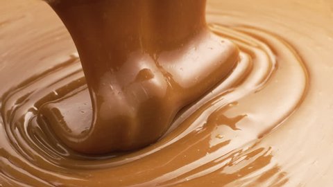Melted caramel pouring in slow motion
