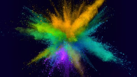 Super slowmotion shot of color powder explosion isolated on blue background. Shot with high speed cinema camera at 1000fps