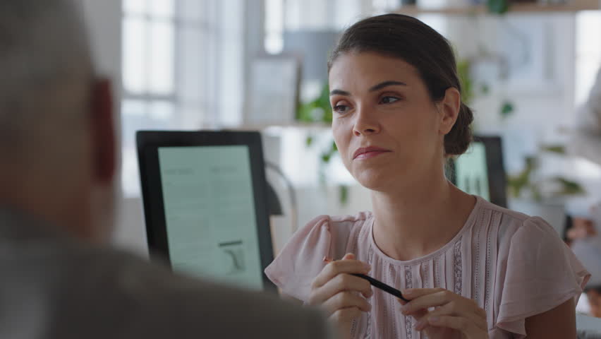 Beautiful business woman chatting to colleague discussing work having conversation in office enjoying teamwork | Shutterstock HD Video #1024983512