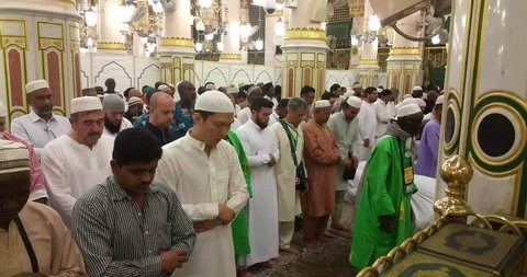 MADINAH, SAUDI ARABIA – September 2016: Muslim pilgrims visiting the beautiful Nabawi Mosque, the Prophet mosque which has great architecture during hajj  season.