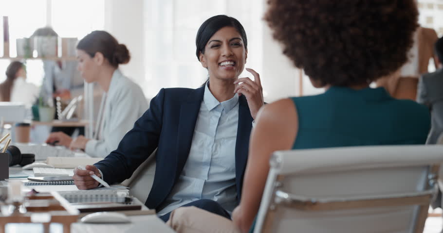 Young indian business woman chatting to intern discussing job interview colleagues having conversation in office enjoying teamwork | Shutterstock HD Video #1025001470