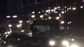 Time-lapse video of traffic leaving Downtown Denver at night. This video shows a close up view of night traffic by Downtown Denver.