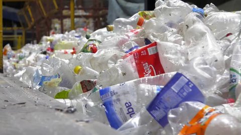 Russia. 08.09.2018:Technological line for sorting secondary material resources. Sort line. escalator with a pile of plastic bottles at the factory for processing and recycling. 