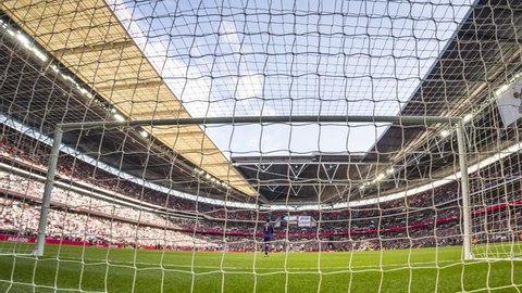 London, England - March 02 2019: time laps behind door during the Premier League match between Tottenham Hotspur and Arsenal at Wembley Stadium
