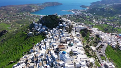 Aerial drone video of picturesque main village or hora of Serifos island with breathtaking views to the Aegean sea in spring, Cyclades islands, Greece