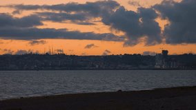 Time lapse with sunset colors in the sky, looking across the bay to downtown of the city of Puerto Montt - Powered by Shutterstock - Get 15% off with code: PIKWIZARD15