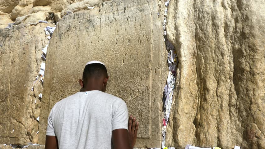 JERUSALEM, ISRAEL - DECEMBER 20, 2018: Ethiopian Jew praying at the Western wall in Jerusalem